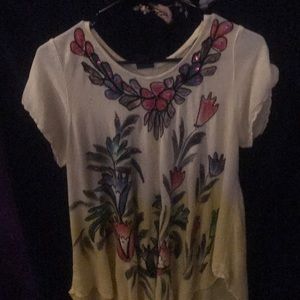 Yellow top with sparkly flowers on it